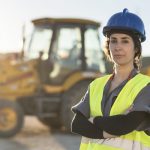 Worker woman looking at camera after working in sunset image