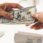 Transfer of money from hand to hand.