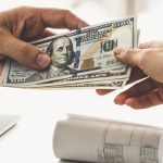 Transfer of money from hand to hand.