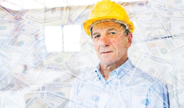 Senior architect or civil engineer on the construction site.