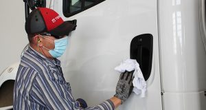 Terex Utilities Releases Tech Tip for Disinfecting Aerial Devices, Digger Derricks disinfecting truck door