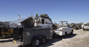 Two-Man Crews Keep Machines Moving